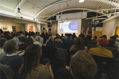 Entrepreneurs make their pitch before an audience of judges, family and friends at the Muskegon Innovation Hub's ElevateWest Accelerator program.